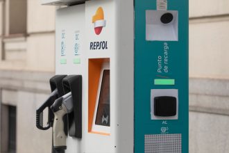 Charging point for electric and hybrid cars in the center of the city of Madrid. Charging station in public roads for electric and sustainable mobility