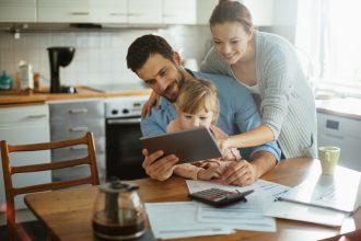 Young family using a digital tablet in the morning.