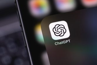 Close up of a phone screen showing the ChatGPT logo. ChatGPT is the main product developed by OpenAI.