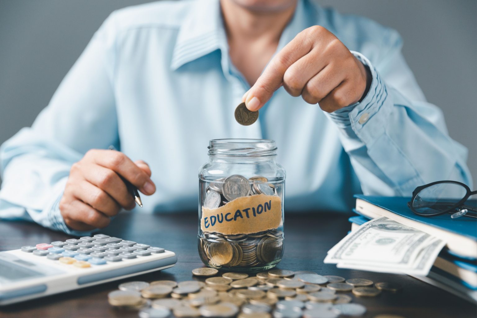 Saving money coin with banking investment, finance education concept. Planning student loan for studying abroad for college or university degree. Future children's education fund cash. Growing saving.