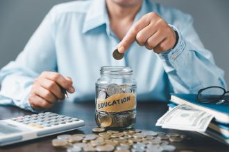 Saving money coin with banking investment, finance education concept. Planning student loan for studying abroad for college or university degree. Future children's education fund cash. Growing saving.