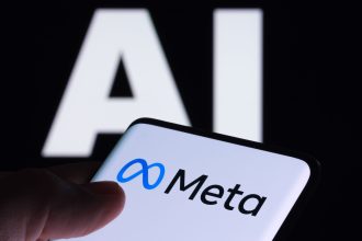 Meta logo seen on smartphone and AI letters on the background. Concept for Meta Facebook Artificial Intelligence. Stafford, UK, May 2, 2023.